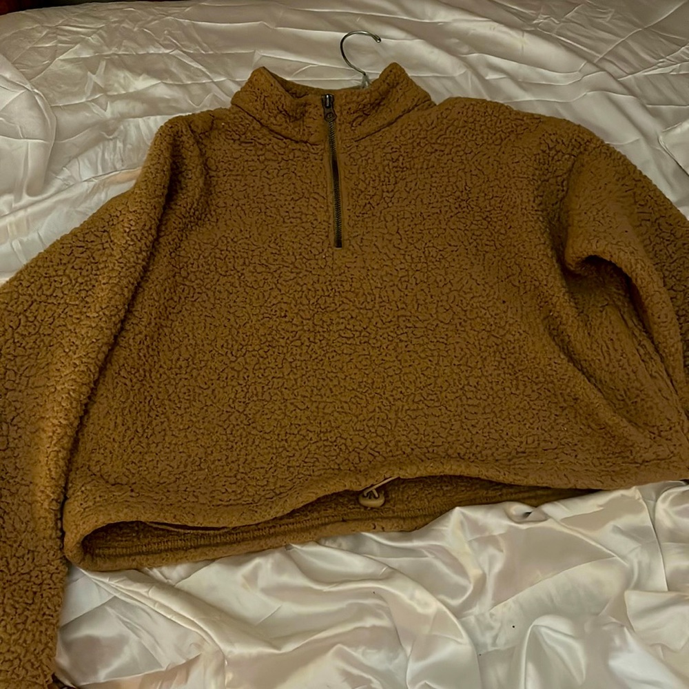 Tan/Brown fluffy cropped jacket from American eagle. I bought 2 on accident 😂